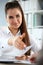 Woman in suit give hand as hello in office portrait