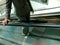 Woman in Suit Going Up the Escalator