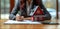 Woman in suit signing paperwork on home model making a real estate deal confidently, home loan paperwork image