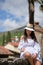 Woman in summer dress walking and running joyful and cheerful smiling in Tuscany, Italy