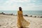 woman summer hippie sea sunlight lifestyle fashion dress person beautiful beach. Generative AI.