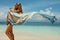 Woman in summer sunbathing on tropical beach on vacation