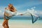 Woman in summer sunbathing on tropical beach on vacation