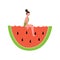 Woman in summer swimsuit sitting on giant watermelon slice