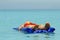 Woman sunbathing on an air mattress