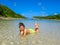 Woman sunbathing in a Caribbean lagoon