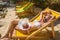 Woman sunbathing on deck