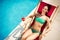 Woman sunbathing at swimming pool