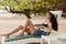 woman sunbed smiling sand sea beach lying ocean lifestyle resort tan