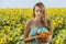 Woman in sunflower chain with a basket of fruit