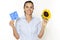 Woman with sunflower and solar cell