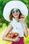 Woman sunglasses hat apples