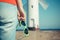 Woman with sunglasses in shape of heart on west breakwater. Windmill Stawa Mlyny in Swinoujscie. Summer and vacation time