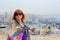 Woman in sunglasses standing near the Suleymaniye mosque with Galata Tower background