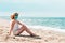 Woman in sunglasses and straw hat wearing medical mask at beach, new normal rules, web banner. Life after pandemic, obligatory use