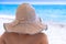 Woman in sunhat on beach