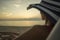 Woman with sunhat overlooking the ocean