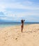 Woman on sunny beach. Tropical beach photo. Beautiful girl on beach.