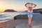 A woman at sunset in Fragolimnionas of Karpathos, Greece