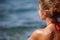 Woman with suntan lotion at the beach