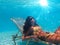 Woman suntanning underwater