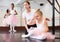 Woman supporting upset little ballerina