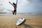 Woman surfer jumping
