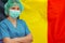 Woman surgeon on the background of the Belgium flag. Health care, surgery and medical concept in Belgium
