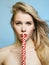 Woman with Sweet Candy. Blonde Girl eating lollipop