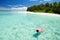 Woman swim and relax in the sea. Happy island lifestyle
