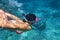 Woman swim underwater in tropical sea