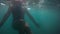 Woman swimming in mediterranean sea. Underwater shot