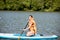 Woman swimming on the paddleboard