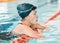 Woman, swimming pool and sports break or thinking of fitness for competition, race or challenge. Profile of athlete