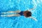 Woman swimming in pool. Top view. Straight body, slim. Breaststroke swimmer.