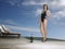 Woman In Swimsuit With Champagne By Pool