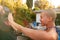 Woman In Swimsuit By Pool Being Filmed With Video Camera