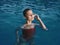 woman in swimsuit in the pool outdoors closed eyes luxury leisure