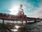 woman in swimsuit at wooden pier. resting at lake