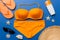 Woman swimwear and beach accessories flat lay top view on colored background Summer travel concept. bikini swimsuit