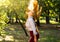 Woman swinging hair in the park, healthy hair concept