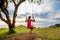 Woman swinging on a swing on a tropical island