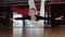 Woman swings in an air hammock above floor during fly yoga.