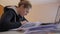 Woman At The Table With Documents