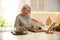 Woman with tablet cooking in kitchen