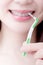 Woman take interdental brush