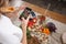 Woman take a picture of different beautiful vegetables and greens with a mobile phone at her kitchen. Smartphone food