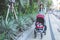 Woman take a walk with her baby inside the baby stroller