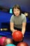 Woman takes ball for playing in bowling