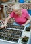 Woman takes care of the seedlings in the home